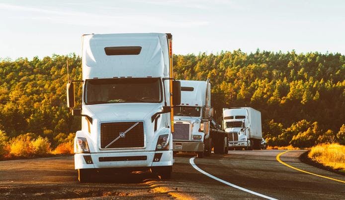 Trucks parked at the side of the road