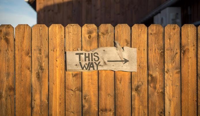 an image of a sign on a fence and how following instructions helps with short term memory