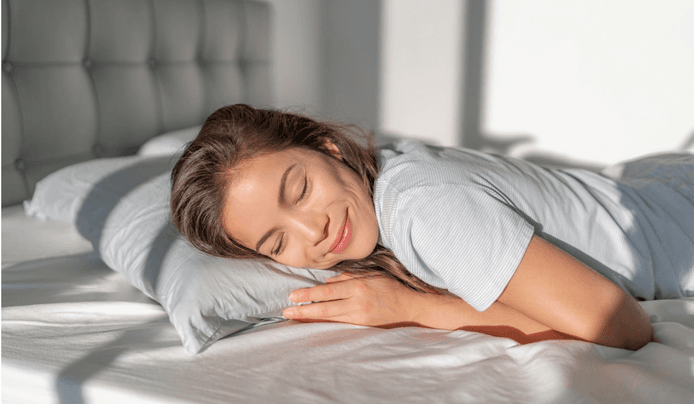 an image of a woman smiling while sleeping