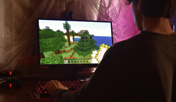 A person playing a game on his computer