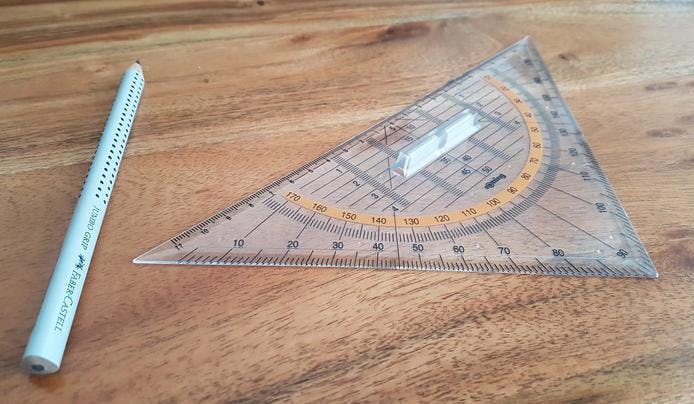 A ruler and pen on a desk
