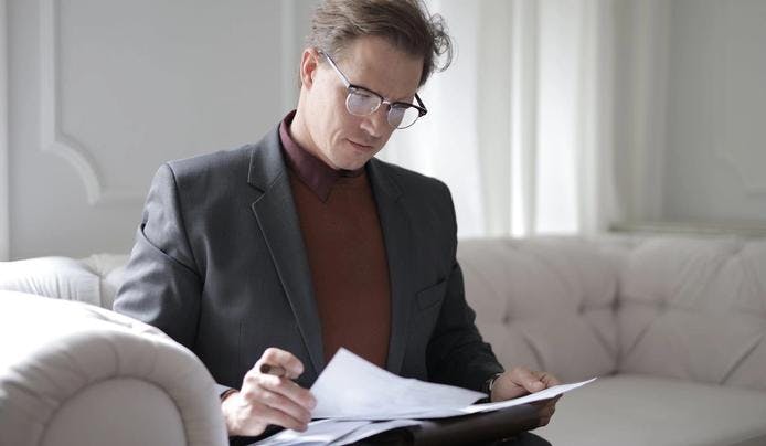 A lawyer looking at multiple documents using his linguistic intelligence